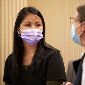 A clinician talking to a patient