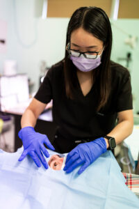 A clinician prepares a patient for an eye injection