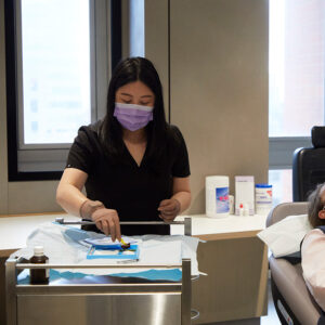 Clinician preparing syringe